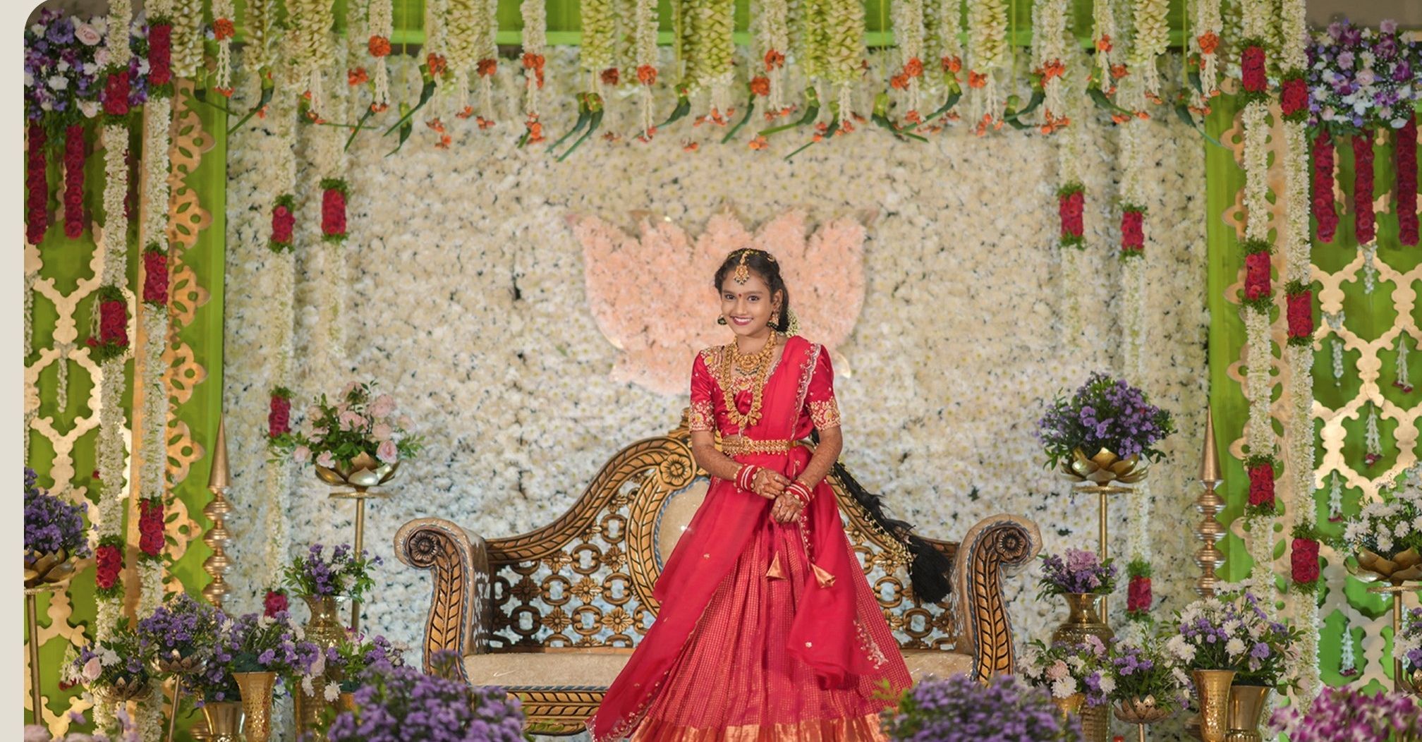 Half saree on a flower-decked stage